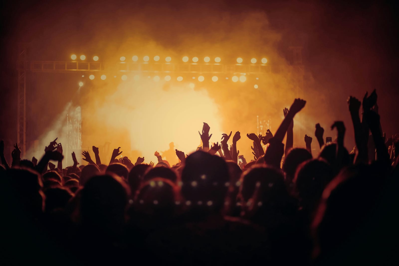 A crowd lit gold at a live show
